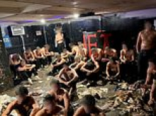 Leaders of underground University of Wisconsin frat arrested after dozens of students found half-naked pledges trapped in sweltering, garbage-covered basement