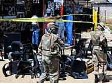 Manhunt launched after 13 men and four women killed in South Africa: Eight gunmen armed with 'AK-47 rifles and pistols' open fire at bar