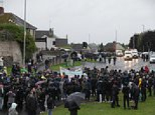 Tense stand-off in Ulster as thousands of protesters attend first loyalist parade for three decades 