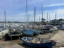 Fears of migrants on the run after boat carrying 18 arrives in quiet Cornish harbour with police making 10 arrests
