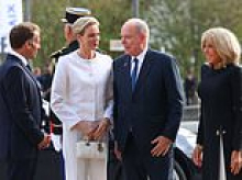Charlene's privilège du blanc: Monaco Princess is elegant in a white trouser suit as she joins the Macrons to meet Pope Leo