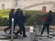 Moment French riot cop shoots teenage protester in the face with a grenade launcher at point-blank range 'tearing his mouth apart'