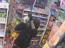 Moment hero shop worker fights off machete-wielding robber with a hockey stick