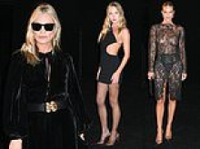 Kate Moss looks glamorous in a black velvet maxi dress as she joins daughter Lila and Rosie Huntington-Whiteley for the Saint Laurent show during Paris Fashion Week