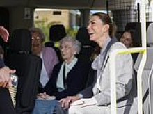 Giggling Kate delights elderly minibus passengers as she joins volunteers community group that helps pensioners enjoy their independence