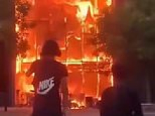 Chaos in France as masked rioters torch schools and douse teachers in petrol after left-wing mayor told protesters 'violence can be legitimate'