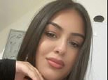 Newborn baby girl whose dead body was found on top of washing machine is named as inquest hears of 33 wounds from 15 stabbings while mother faces murder trial