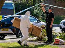 Bomb squad are called in as police find explosives, guns and drugs in house search after 150 homes are evacuated and 70-year-old man is arrested