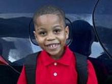 Four teenagers charged with murder over 'unthinkable' killing of four-year-old boy who was shot while asleep in his bed