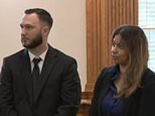 Well-dressed parents appear in court charged with letting three-year-old son bring loaded gun to daycare