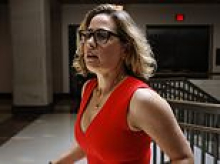 Former Senator Kyrsten Sinema's love triangle saga takes dark turn as her bodyguard ex is arrested over gun plot