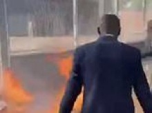 Left-wing Parisian mayor joins in the riots convulsing France - as firefighter is set alight and protesters threaten to burn down the Elysee Palace