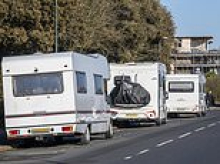 Van dwellers accused of turning seaside town into 'unregulated campsite' by parking up for months at a time outside homes of furious locals