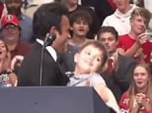 Humiliating moment GOP gubernatorial candidate Vivek Ramaswamy almost drops boy, 10, as he struggles to pick him up during rally