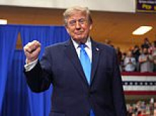 Re-energized Trump curses as he brags about 'shoving it up the a**' of Democrats and takes another shot at his favorite target Kaitlan Collins... after crowd was fired up by NFL legend