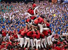 A competition with high stakes! Thousands come together for traditional Spanish Castells event that sees crowds battle to build the highest human tower