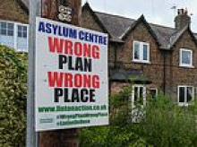 Dozens of villagers are threatening to 'sell up and move' as they fear the arrival of more than 1,000 migrants who could soon be housed in nearby RAF base