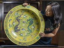 Giant Qing porcelain dish worth £30,000 that was made for Beijing's Forbidden City is found under family's sofa in north London home