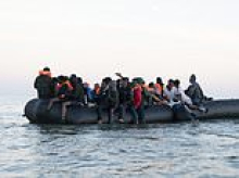 Two men dead and two women severely burned following fire on overcrowded mega-dinghy heading for Britain from France