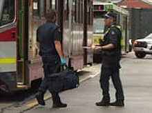 Horror as woman is allegedly stabbed in the neck by a stranger while getting off a Melbourne tram