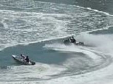 Shocking moment Aussie teen jet ski riders allegedly capsize tinnie carrying two young boys as police warn of possible charges