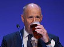 Living the dream! Tory chairman enjoys morning pint of warm beer alongside a labrador after Labour minister's 'Far Right' attack on country life