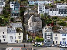 Woman in her 40s found dead and man in hospital after 'axe attack' in seaside town as suspect arrested for murder