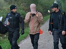 'Migrant hunters' clash with French police while trying to stop small boats heading to the UK