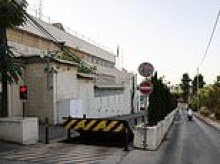 Workers remove signage from British consulate in Jerusalem after Israel ordered it to close after Labour announced West Bank sanctions