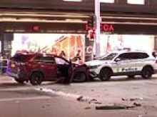 Man carjacks woman before ploughing into police car and striking pedestrian in Sydney CBD rampage