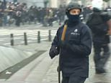 Student riots spread to Belgium as hundreds of hooded protesters clash with cops sparking 'total chaos' in Brussels