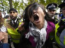 Thousands of pro-Palestinian protesters march through London just days after October 7 anniversary as police warn anyone covering their face could be arrested