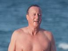 David Cameron makes a splash as he enjoys cold plunge at the beach with friends to mark the start of his 60th birthday celebrations
