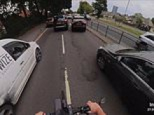 Moment 'hated' cycling vigilante dodges traffic jam by following police car on a 999 call