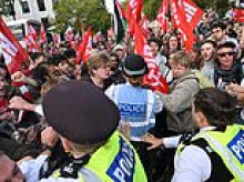 Trampling on the memory of The Few: Pro-Palestine thugs spark fury as they stamp on poppies and clamber over Battle of Britain memorial as march descends into violence