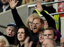That's not much of a welcome, TV commentator quips as rowdy rugby fans boo Harry - while Sussex Squad insists they were jeering the referee