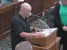 Small-town Iowa council meeting is opened by resident praying to Satan before stunned members scramble to 'reverse the curse'