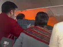 Passenger jet makes emergency landing after power bank bursts into flames