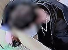 Moment thief steals tortoise from pet shop after picking it up and stuffing it into his coat pocket