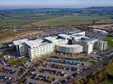 Woman in her 30s 'is raped in GP surgery car park': Four men are arrested