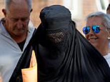 Anti-migrant protester arrives at court in burqa after he was charged with  breaching face-covering ban by wearing full Islamic dress to Portsmouth demo