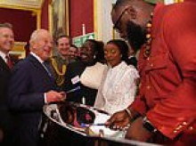 King of music! Charles couldn't resist playing the steel pans during palace reception