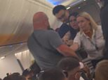 Moment brawl erupts on Ryanair flight to Ibiza with crew screaming 'sit down' after tourist 'ignored seatbelt sign and attacked passengers' as jet prepared to land