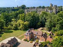 A £4.5m country home with its own private island hits the market - complete with an outdoor bar and Warwick Castle as its neighbour