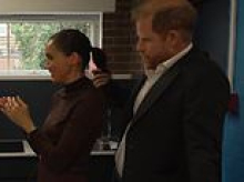 Prince Harry caught playing with Meghan's ponytail during visit to Nottingham before revealing son Archie 'hates math' - while Lilibet 'loves' gymnastics