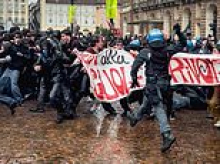 Europe's student riots spread to Italy as hooded protesters clash with cops sparking chaos in cities