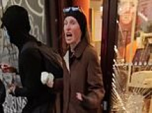 Moment French rioters attack shopkeeper and distraught woman begs them not to loot store as police admit they've 'lost control' of violent protests that saw 143-year-old town hall incinerated