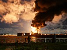 Russian oil terminal and data centre in St Petersburg ablaze as Kyiv launches massive drone attack after Trump's decision to waive sanctions and 'slow down' satellites