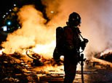 Shocking images emerge from Paris after night of devastation as violent protests spread across Europe and Trump blames 'immigration' for the spiraling disorder