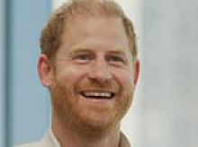 Prince Harry says he 'wants it to work out' with his family... but takes a jab at those who 'don't want to'